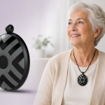 Elderly woman wearing a compact fall detection pendant designed for everyday independence